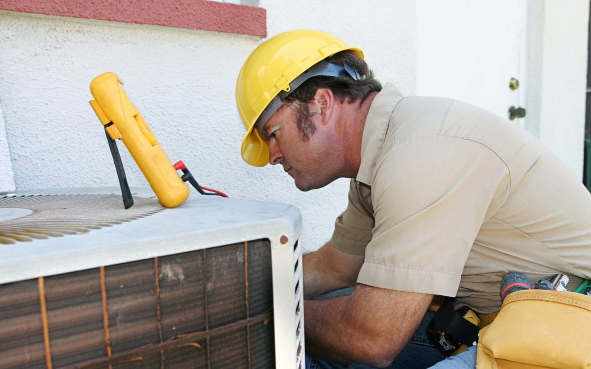 HVAC Technician Working on Cooling System Albuquerque